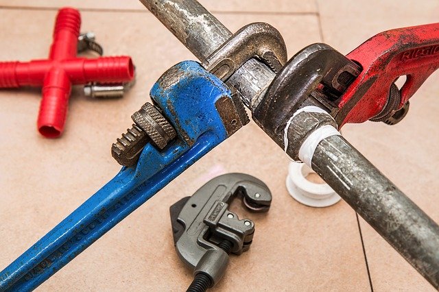 Plumbing tools- replumbing an old house is a service we offer in Georgia.