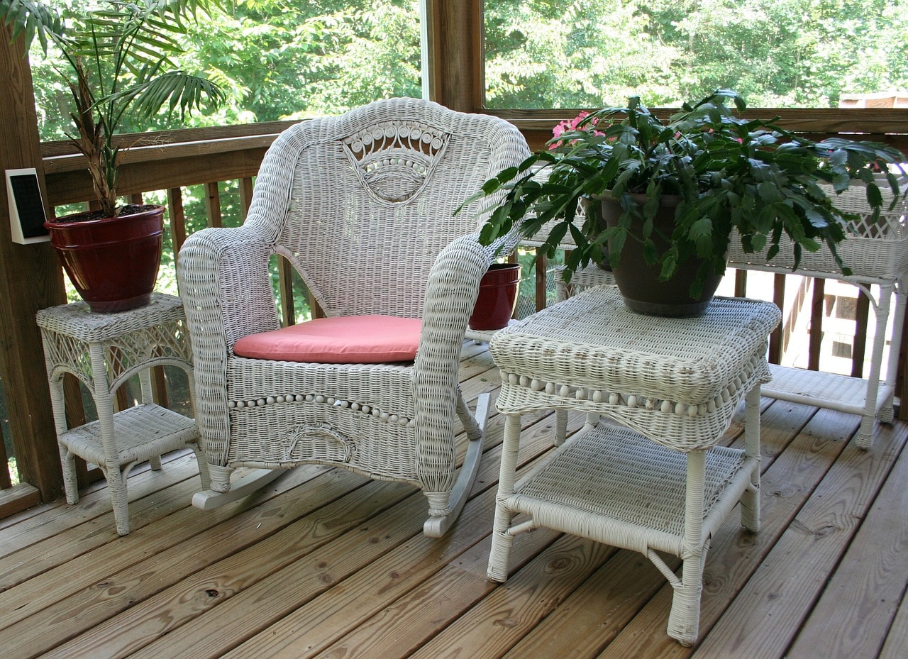 Wicker rocking chair on a screen porch!
