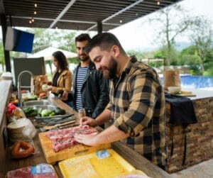 Outdoor kitchens- men grilling steaks and enjoying the outdoor kitchen