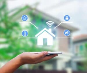 A hand holding a graphic with a smart home-Smart Homes Solution featured image